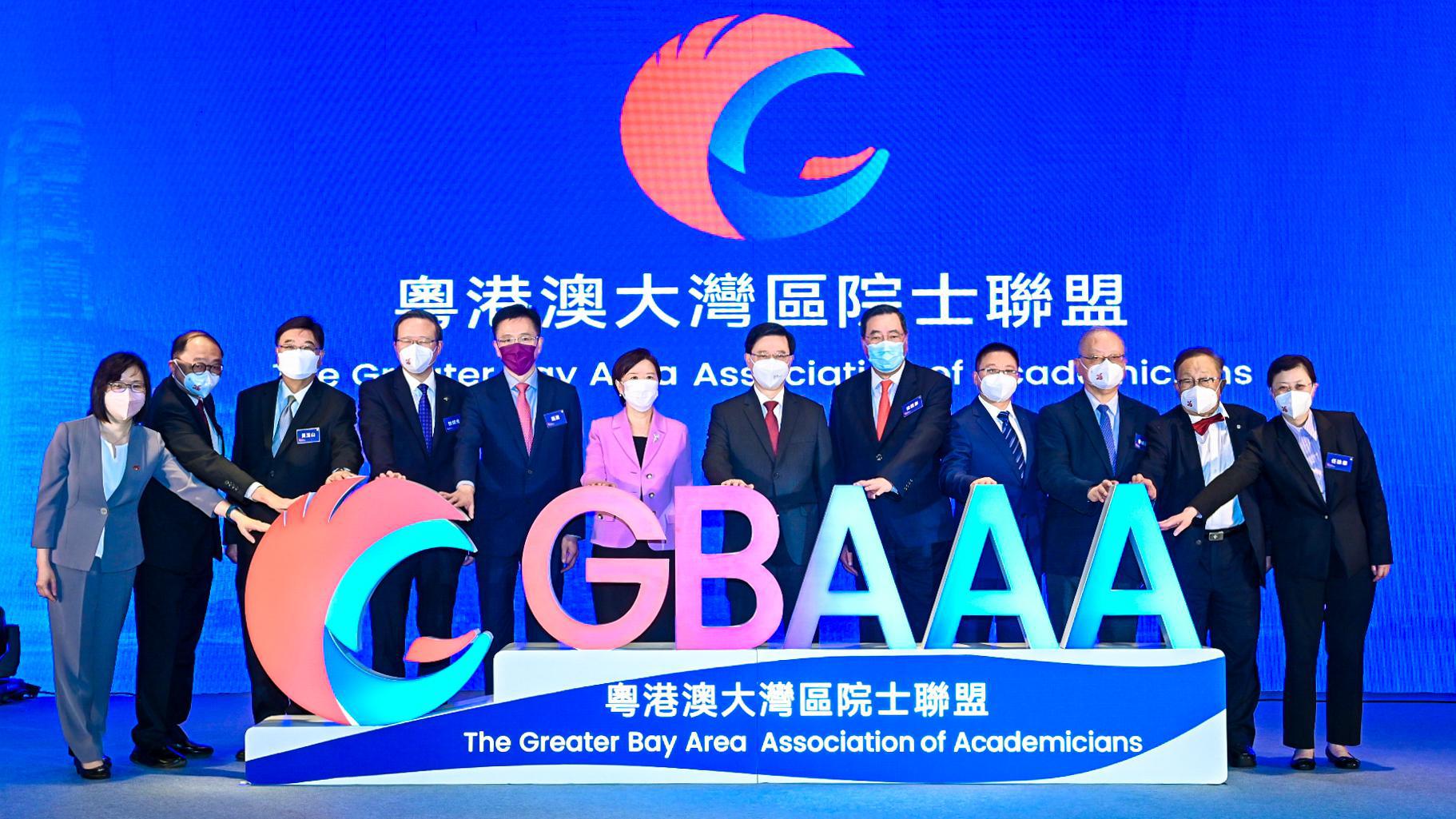 A group of people posing for a photo
Description automatically generated